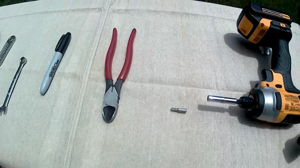 Cordless impact driver and hand cutters used during aquaponics system construction