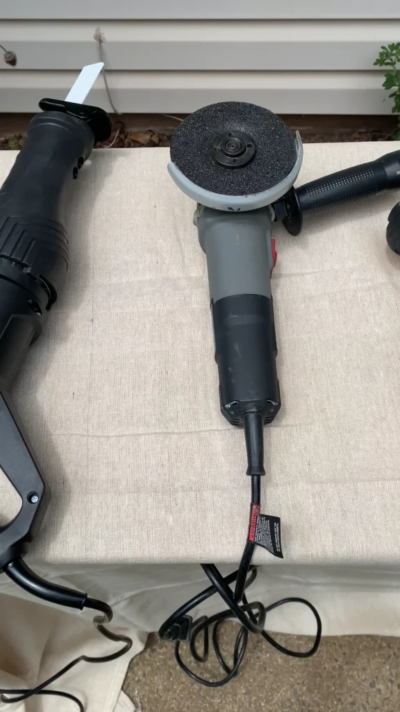 Reciprocating saw and angle grinder used during an IBC aquaponics build